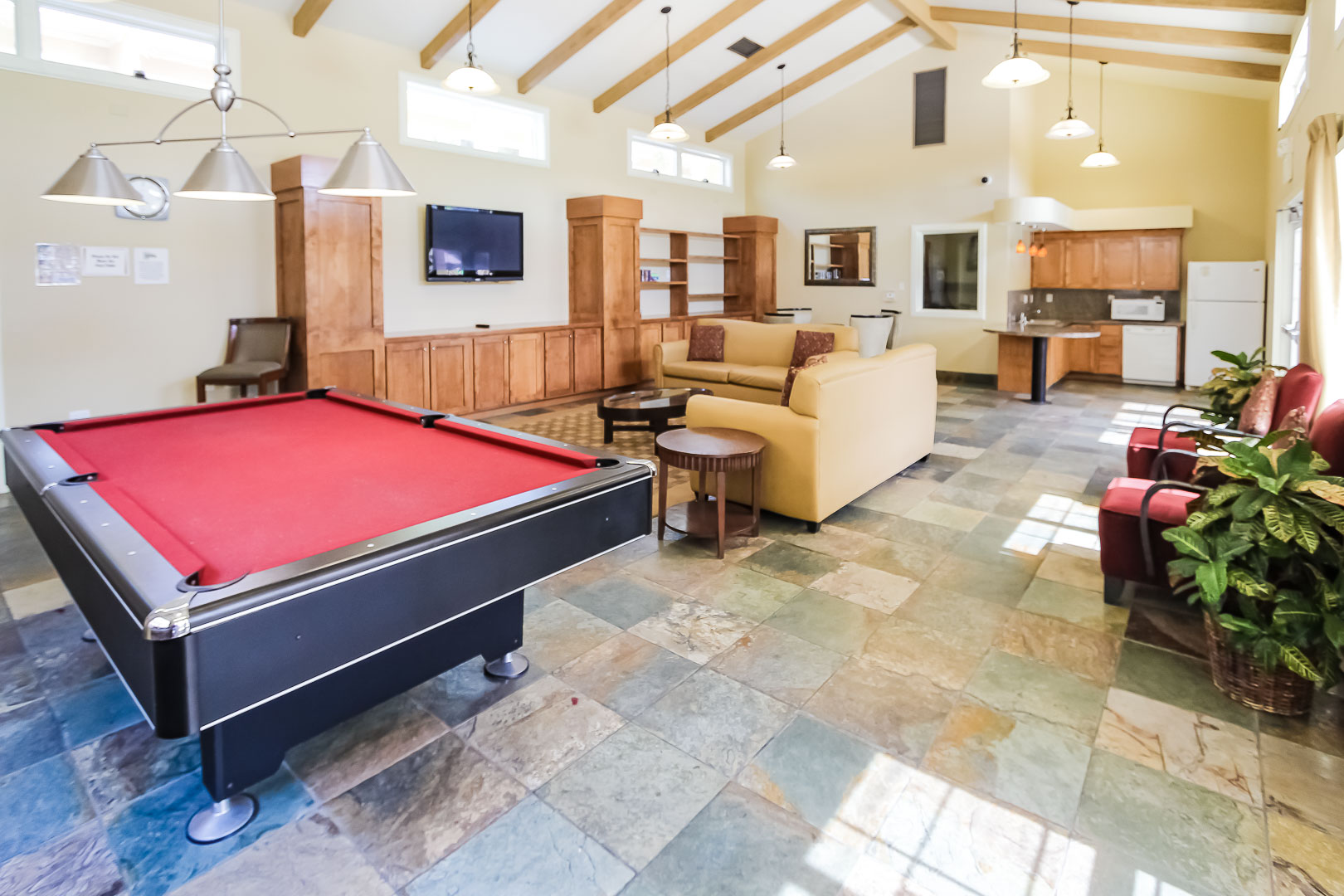 A community area with a pool table at VRI's Winner Circle Resort in California.
